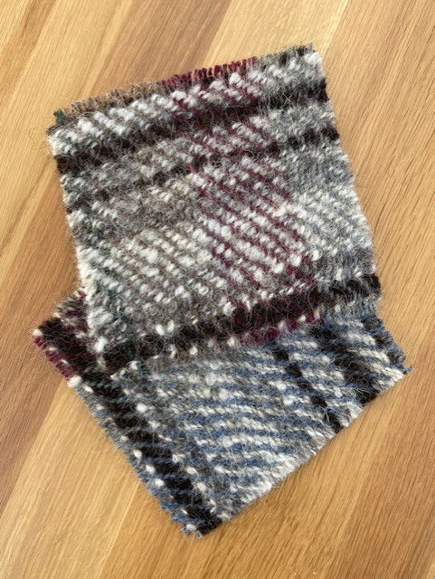 Thumbnail: two handwoven woollen wool coasters in autumnal burgundy, green, grey and natural shades with hand spun yarn