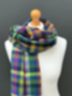 handwoven blue, lime and pink luxury scarf on a mannequin