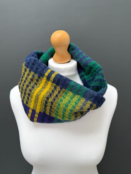 Thumbnail: Handwoven purple, green and yellow merino snood showing the double-fold wear position on mannequin