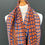 Thumbnail: woven intricately patterned merino scarf on a mannequin against a grey wall