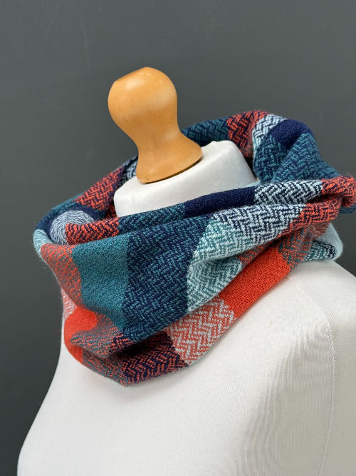 handwoven navy blue and orange snood scarf