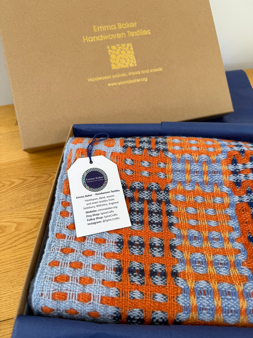 handwoven intricately patterned merino snood scarf in a brown blue tissue paper lined gift box