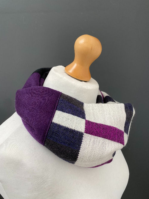 Thumbnail: white, pink, purple, and black handwoven geometric cowl snood scarf