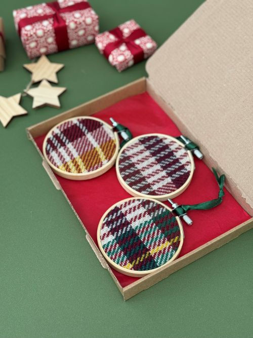Thumbnail: three handwoven emma baker christmas bauble decorations in a gift box