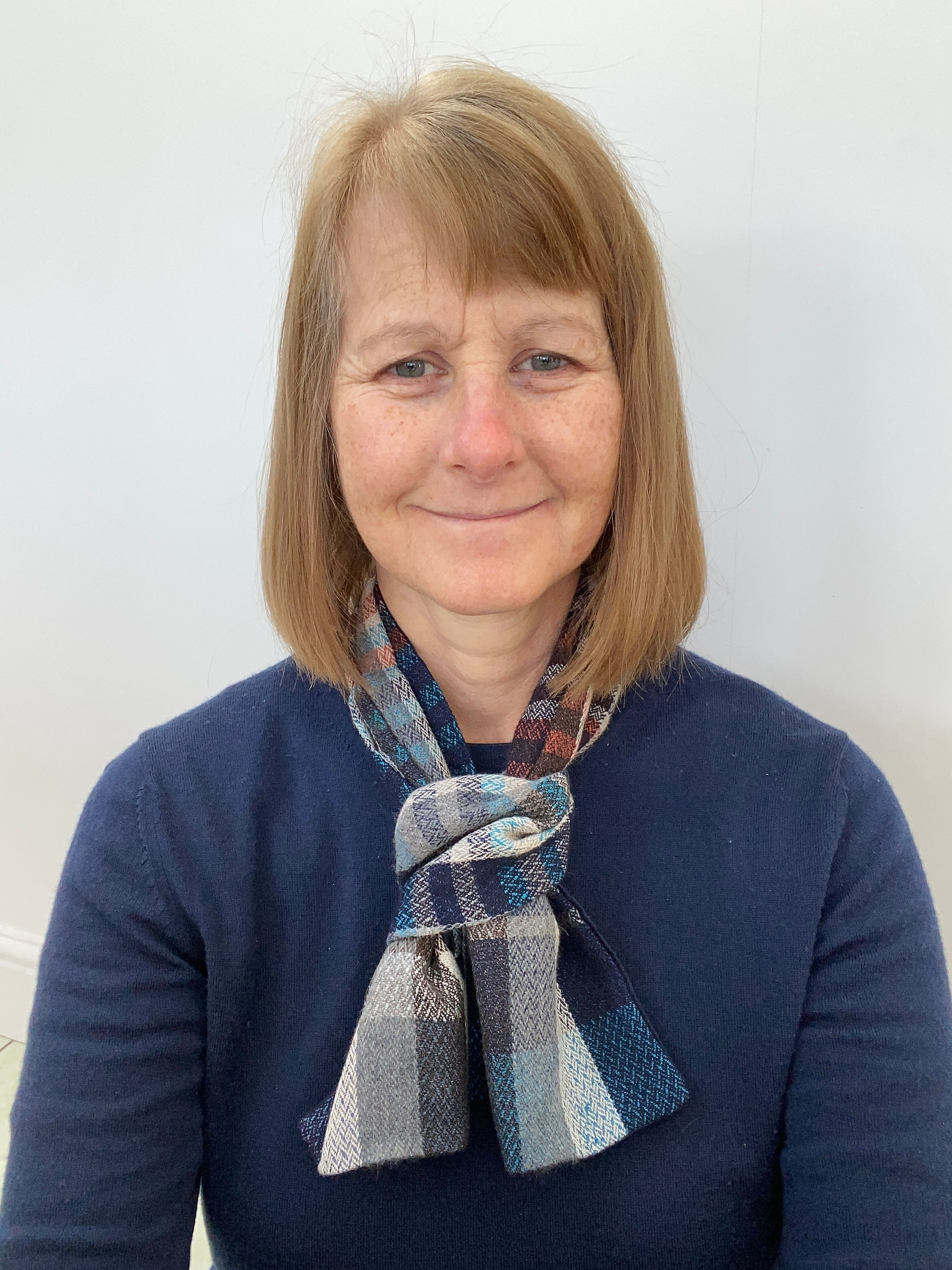 emma baker wearing a cravat that she has made from wool and silk fabric she has woven