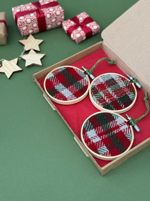 Thumbnail: three handwoven emma baker christmas bauble decorations in a gift box