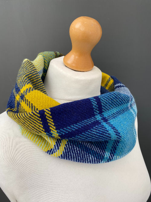 Thumbnail: Blue and yellow twill merino lambswool being handwoven on a floor loom — made by Emma Baker in Salisbury, Wiltshire