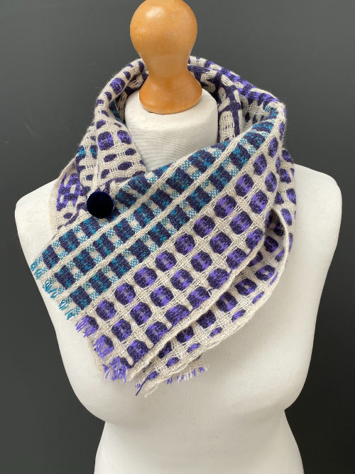 Thumbnail: handwoven purple, teal, white, orange, merino lambswool short scarf with a blue pin badge