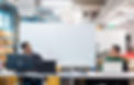 Two StartingBlock members brainstorming in the innovation space in front of a whiteboard