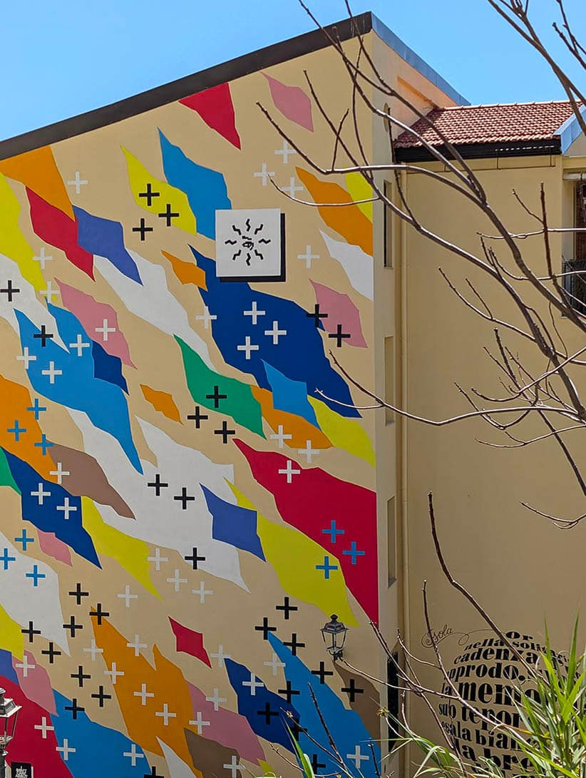 Abstraction and street art: close-up of the bold color palette used by UNO for his landmark mural in the South of Italy.