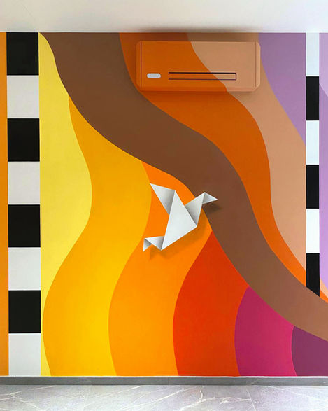 Detail of a mural with geometric patterns and vibrant colors