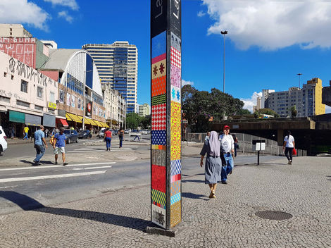 Totem, spray-painted three-sided station marker in Lagoinha, Belo Horizonte, Brazil, 2019, vertical patchwork
