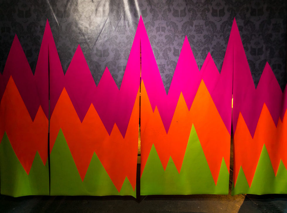 UNO's /OUTSIDE IN installation: five geometric fluorescent stages acting as a threshold at Outdoor Festival 2018, Rome.