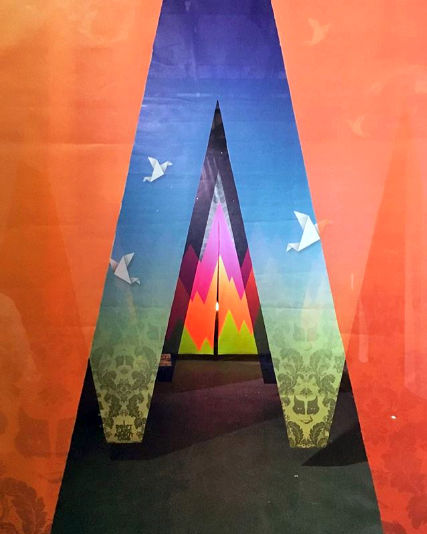 Close-up detail of a fluorescent geometric panel from UNO's /OUTSIDE IN installation.