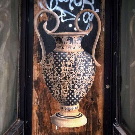 Detail of UNO's Gunter series: the iconic kinder face integrated into a geometric pattern on paper.