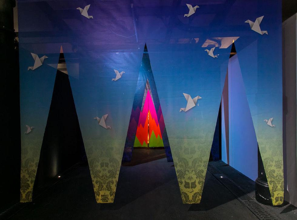 UNO's /OUTSIDE IN installation: five geometric fluorescent stages acting as a threshold at Outdoor Festival 2018, Rome.