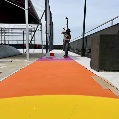 site-specific artwork located on a large rooftop space in Rome (casilino sky park). The piece consists of a vividly painted