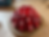 Red and white polka dot baking mold on a wooden surface