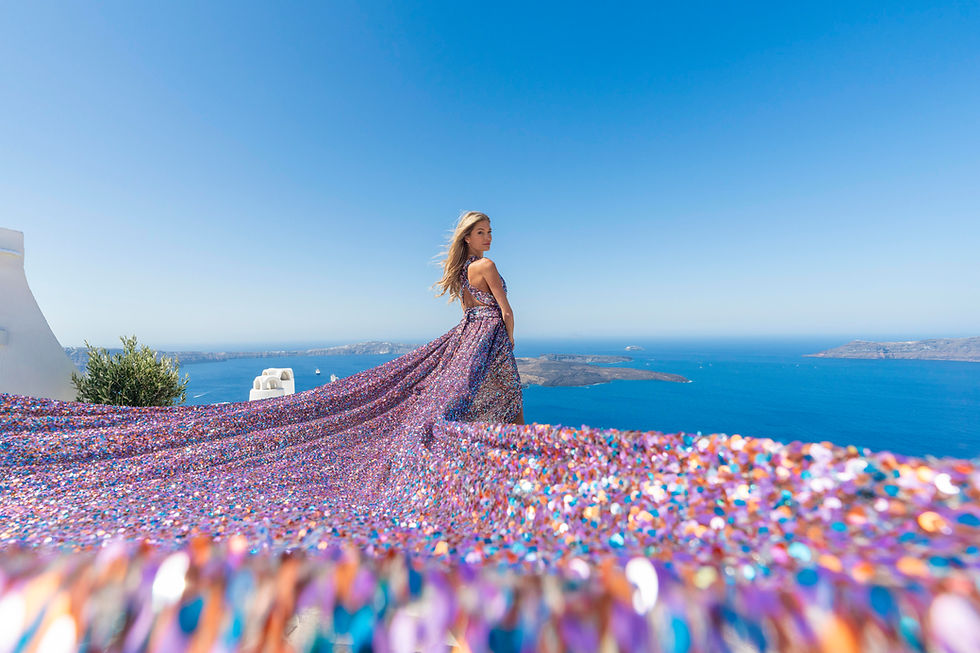 hidden photoshoot locations Santorini without crowds flying dress