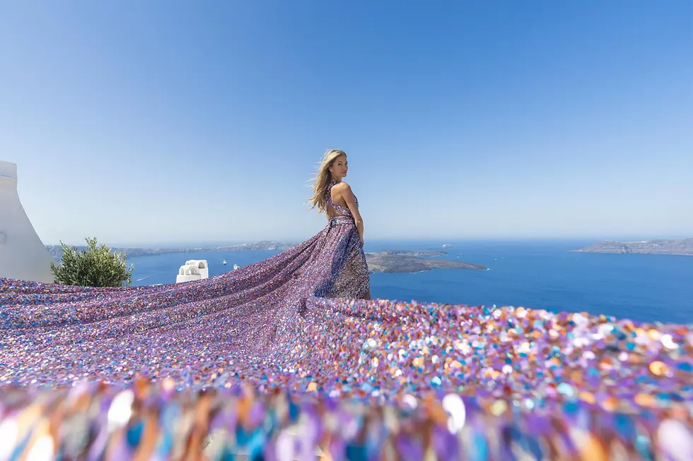 hidden photoshoot locations Santorini without crowds flying dress