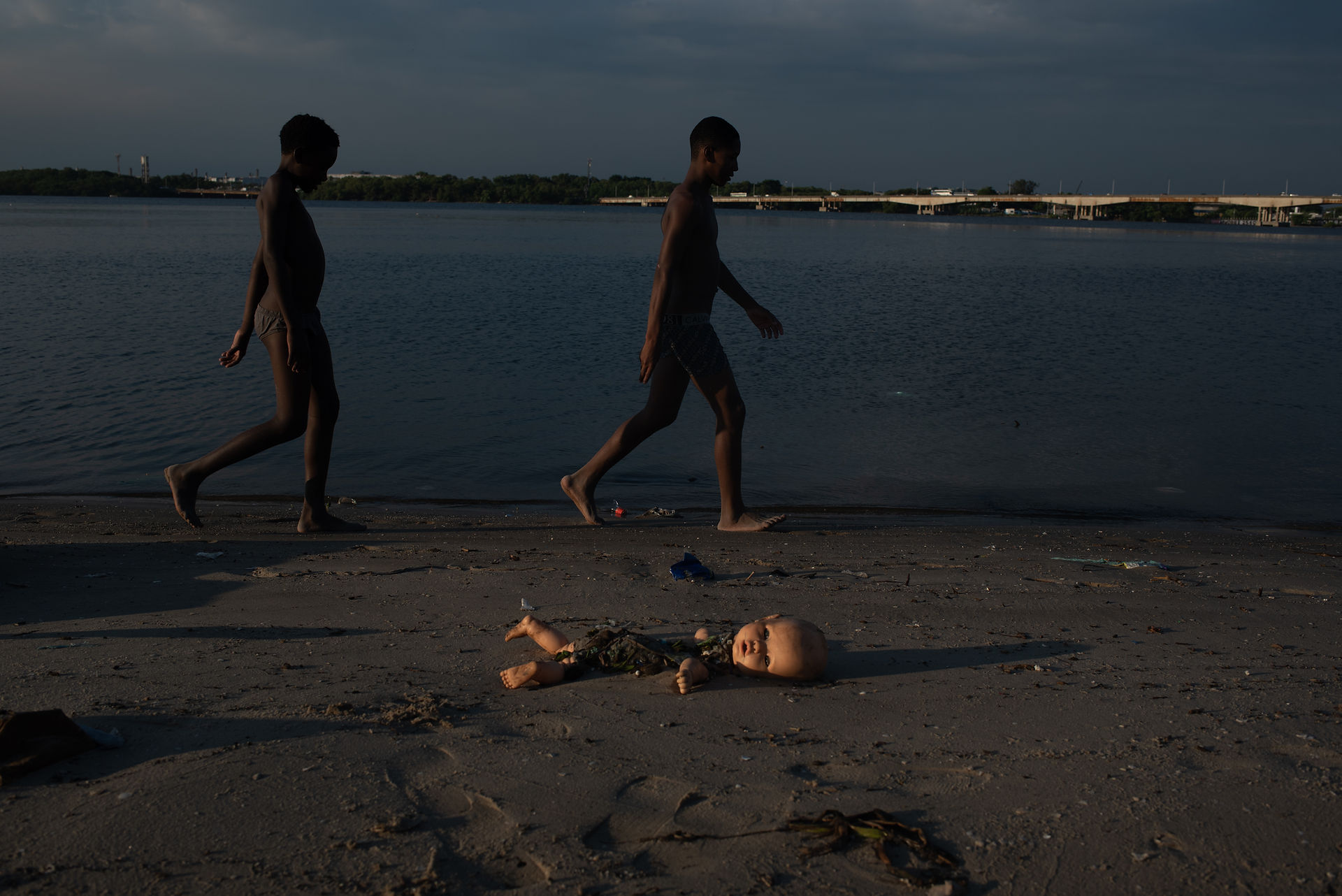 Children play and swim in the Guanabara Bay despite pollution