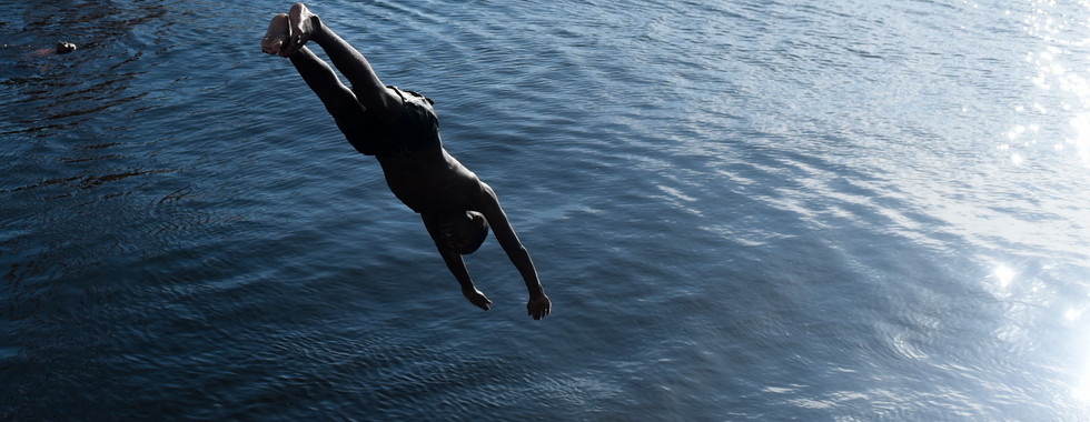 Children play and swim in the Guanabara Bay despite pollution