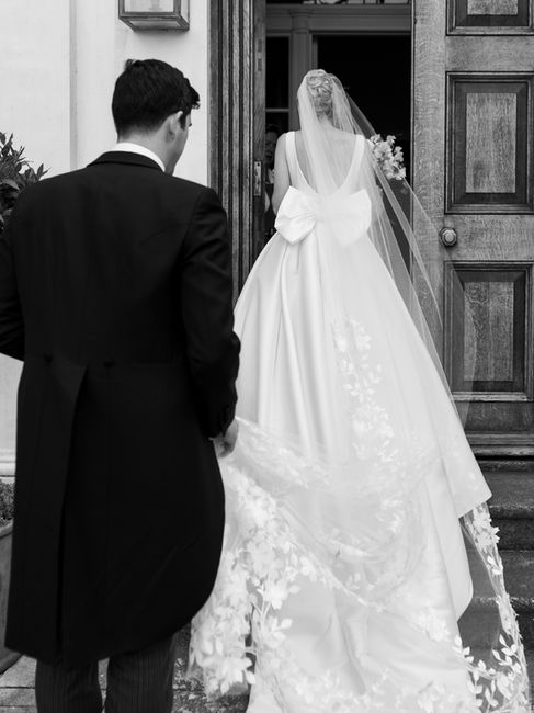 bride and groom walking into findon place