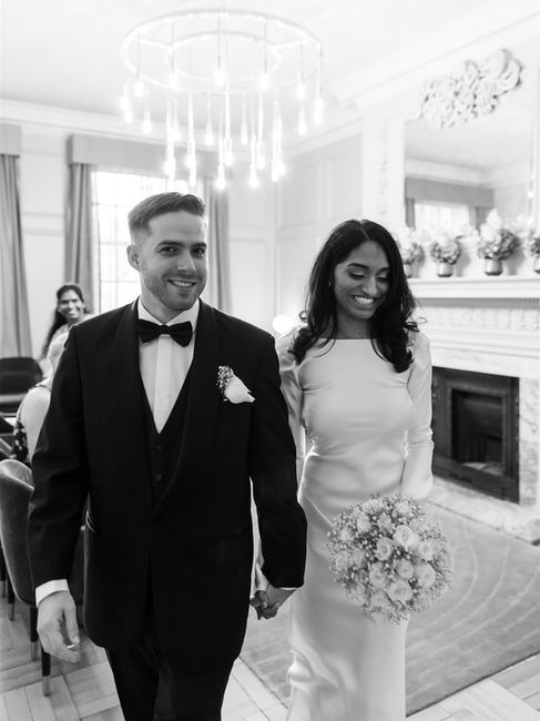 brdie and groom walking out of Pimlico room at Old Marylebone Town Hall