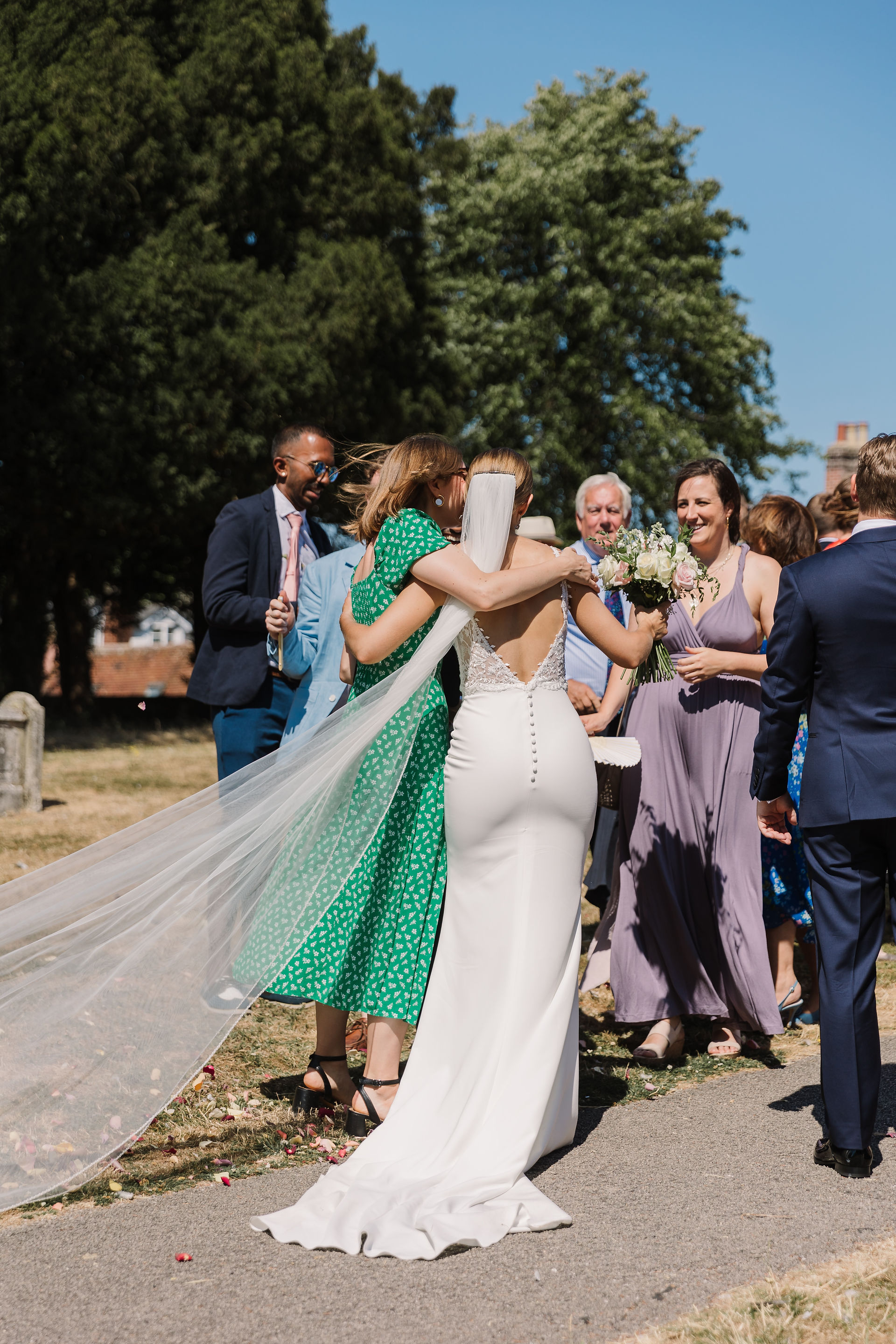 bride hugging guest