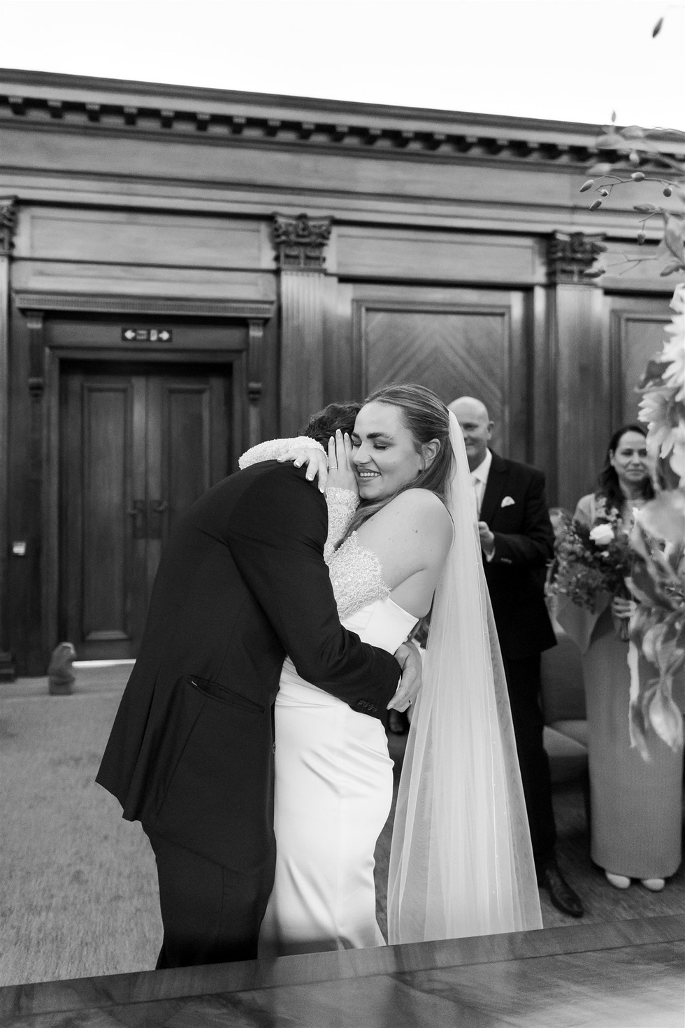 bride and groom hugging during ceremony