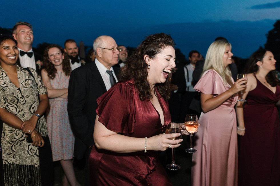 candid photo of guests laughing at speeches