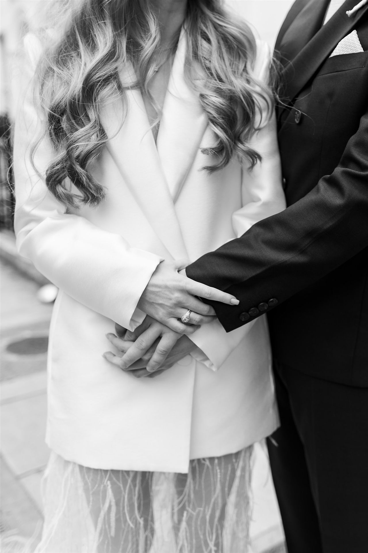 detail shot of bride and grooms hands