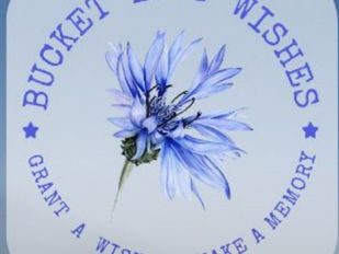 Image of a cornflower with the text 'Bucket List Wishes' and 'Grant a Wish, Make a Memory' surrounding it, symbolising hope and the mission of fulfilling meaningful wishes for individuals facing life-limiting illnesses.