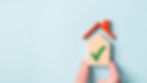 Image of a house with a green tick inside, symbolising a successful mortgage agreement in principle for buying a property.