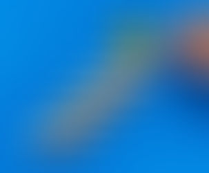 Wooden blocks spelling 'Remortgage' arranged as a climbing staircase leading up to a glowing light bulb, with a hand holding a pen, symbolising the expert planning and financial progress achieved with Beechwood Mortgages in Reading.