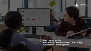 Impact assessment consultant discussing CSR program data with their client