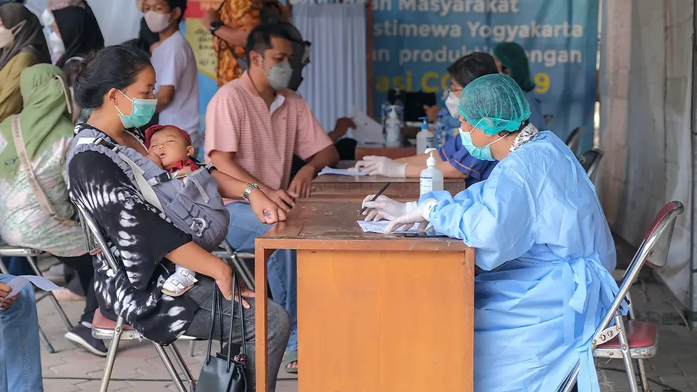 Mother and child attending healthcare camp under CSR programs