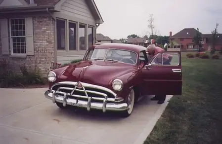 roy-is-introduced-to-his-new-1951-hudson-pacemaker.webp
