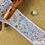 Thumbnail: Asian/Indian style decorative printed grosgrain ribbon trim design of paisleys flowers blues pink yellow purple white
