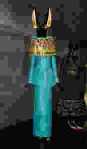 Ancient Egyptian Influence - John Galliano Spring/Summer 2014 in Python Leather, modelled on the God Anubis using turquoise to symbolise the Nile. Headpiece by Stephen Jones.