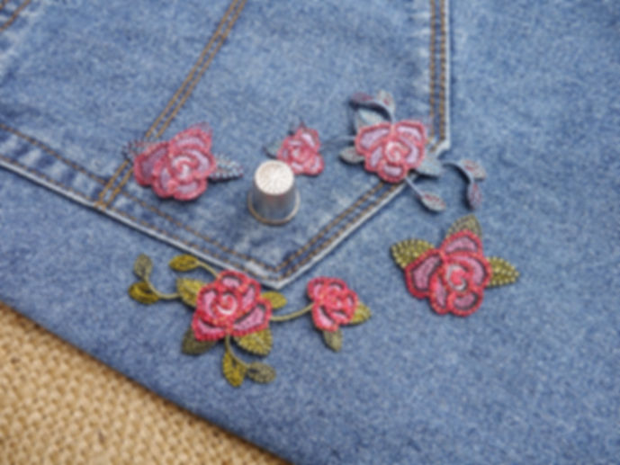 Embroidered appliques with a red blue rose flower design. Rose flower glittery thread texture Mokshatrim Haberdashery