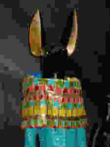 John Galliano Spring/Summer 2014 in Python Leather, modelled on the God Anubis using turquoise to symbolise the Nile. Headpiece by Stephen Jones.