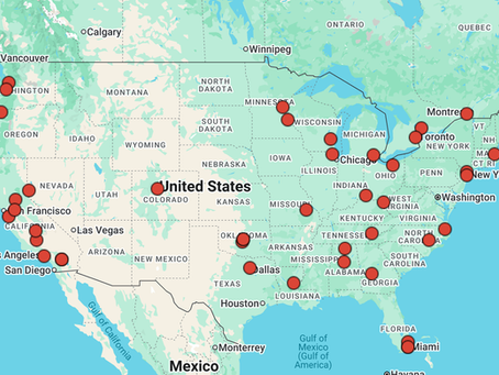 Map of North America with red dots marking major cities, including New York, Los Angeles, and Miami. Blue ocean borders, green land.