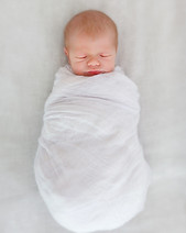 sleeping newborn baby in a wrap.jpg