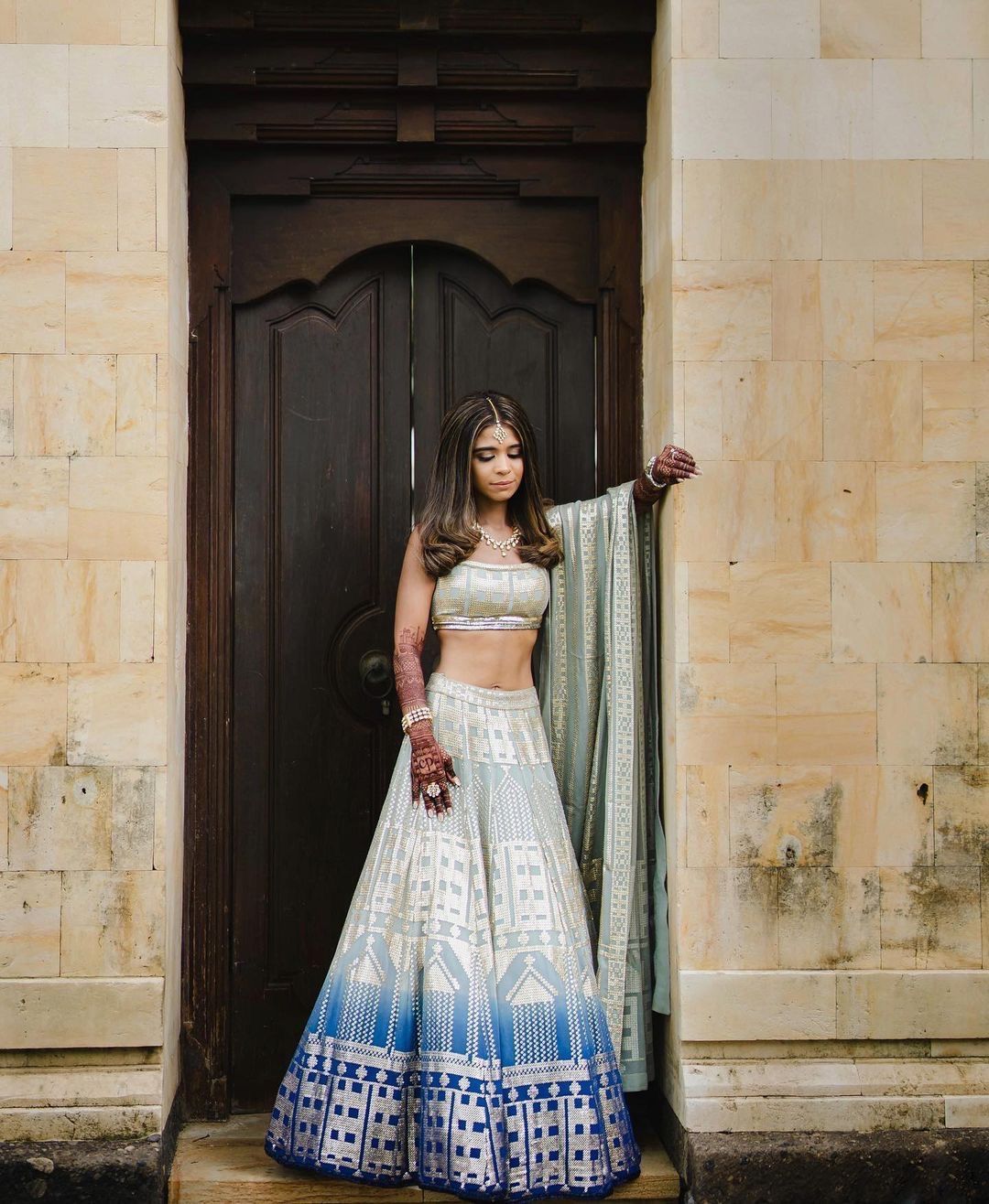 Bride in silver and blue ombre lehenga