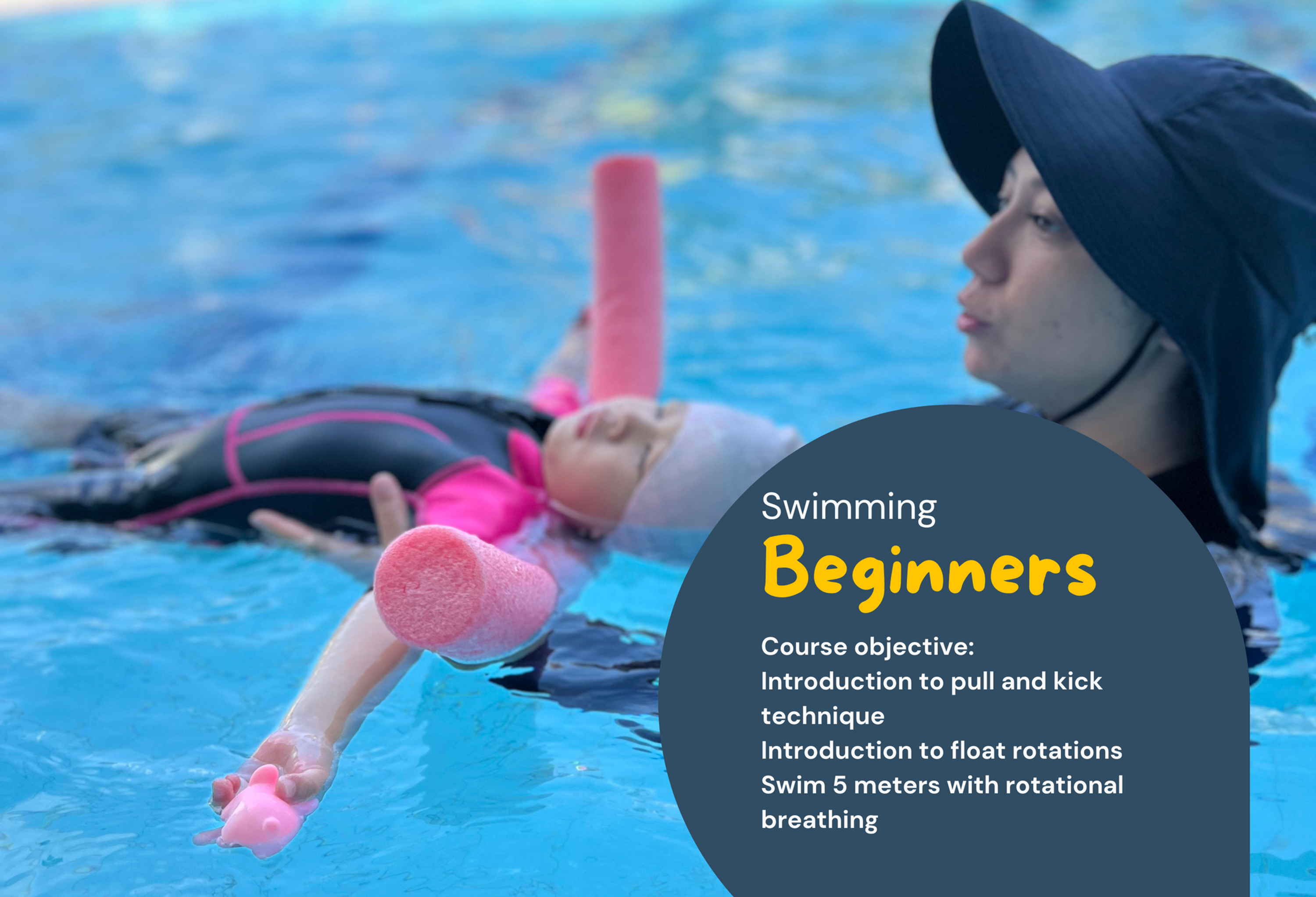 Child in beginner swimming lesson with instructor