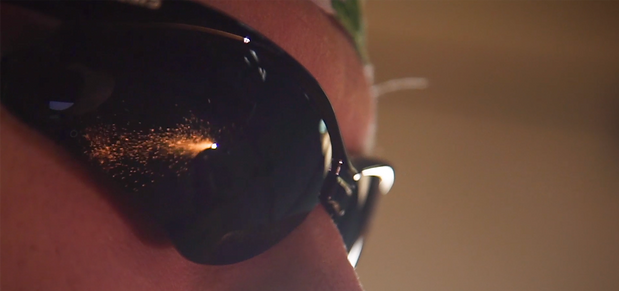 reflection of welding sparks in safety glasses