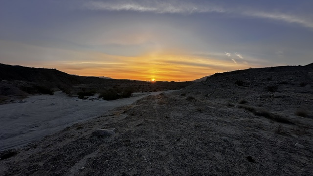 Sun setting over the desert wash