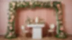 Eye-level view of a whimsical wedding photo booth decorated with flowers and props