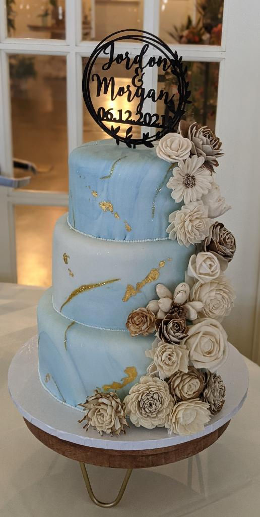 Blue and Gold Marbled Wedding Cake with Tumbling Flowers